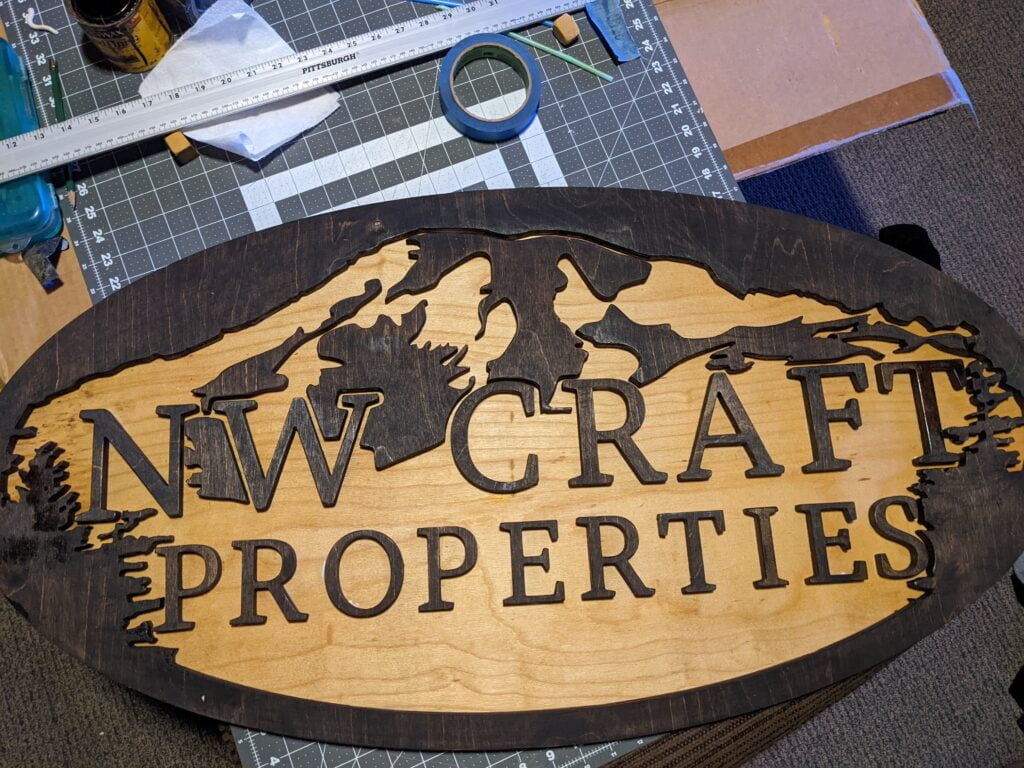 Custom wood CNC stained sign for real estate company by Galactic Sign Co.