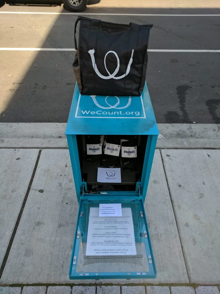 newspaper box and vinyl logo reusable bag design for non-profit in Seattle by Galactic Sign Co.