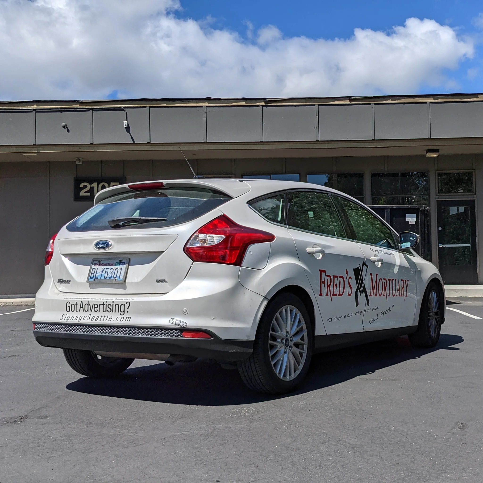 Custom vehicle graphics on a car for a small business