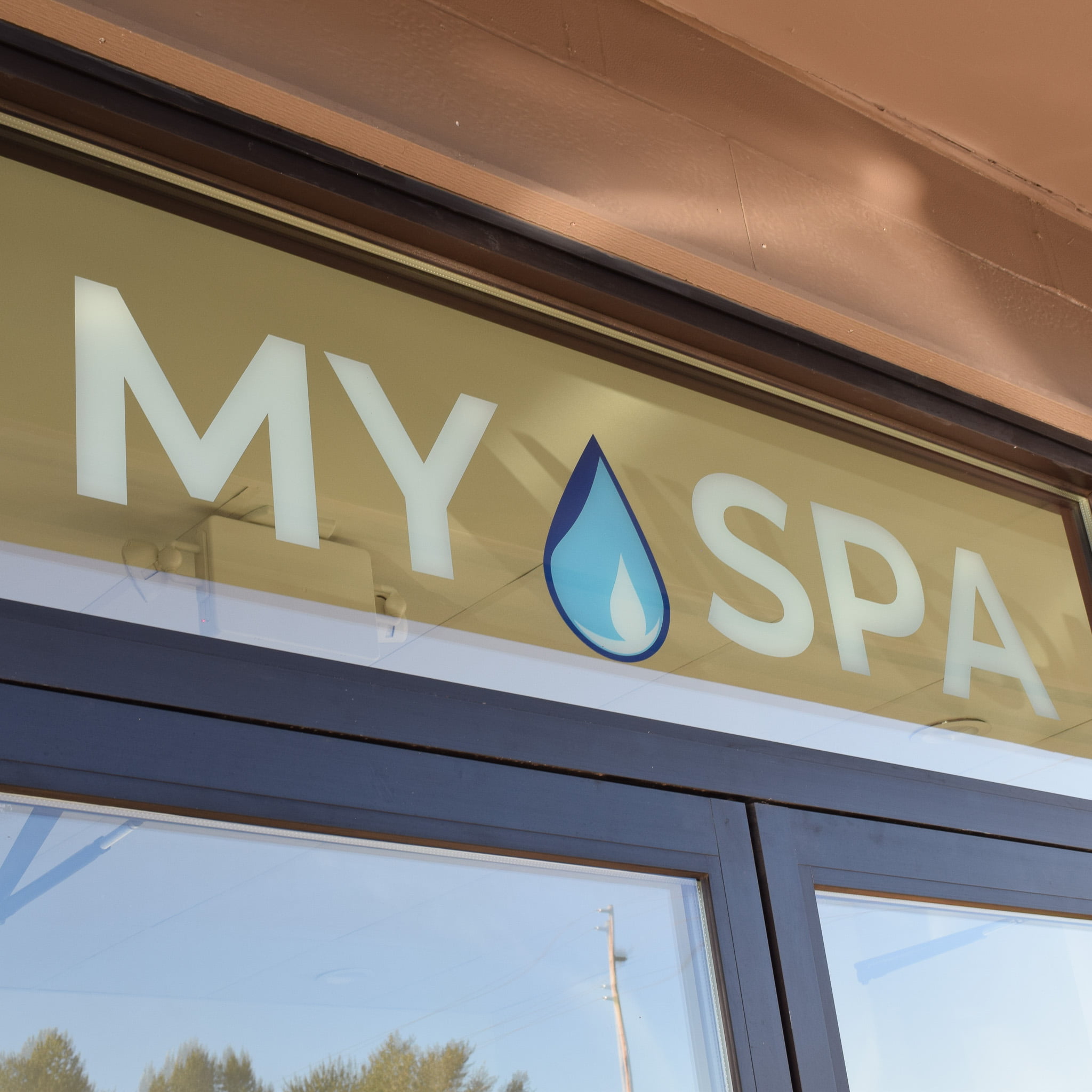 Window signage vinyl storefront for small business spa in Bellevue, WA
